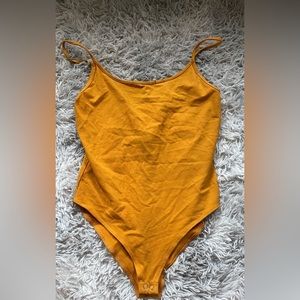 Yellow body suit